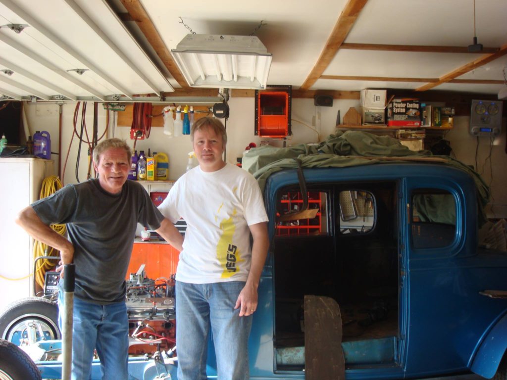 John McKenzie and Charlie Shew standing in front of the 32 Chevy